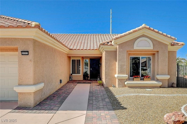 3112 Haddon Dr, Las Vegas, NV 89134 - doorway to property with stucco siding, a tile roof, and a garage