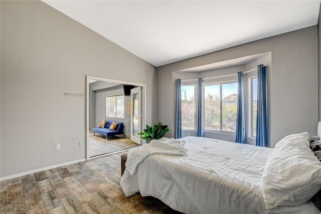 3112 Haddon Dr, Las Vegas, NV 89134 - bedroom with wood finished floors and vaulted ceiling