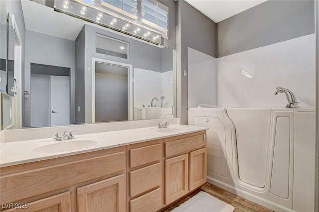 3112 Haddon Dr, Las Vegas, NV 89134 - full bathroom featuring double vanity, a tub, and wood finished floors