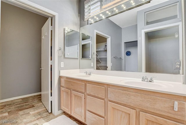 3112 Haddon Dr, Las Vegas, NV 89134 - bathroom featuring double vanity, wood finished floors, and a walk in closet