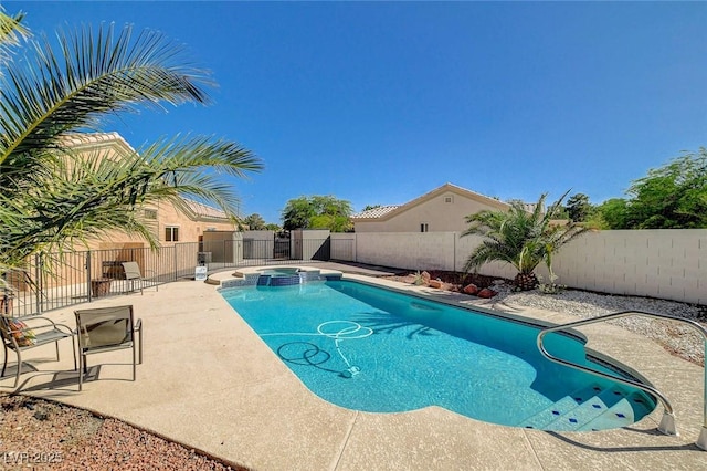 3112 Haddon Dr, Las Vegas, NV 89134 - view of swimming pool featuring a pool with connected hot tub, a fenced backyard, and a patio area
