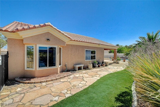 3112 Haddon Dr, Las Vegas, NV 89134 - back of house featuring a patio area, stucco siding, and a tile roof