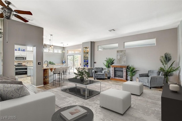 3112 Haddon Dr, Las Vegas, NV 89134 - living area featuring a ceiling fan and a fireplace