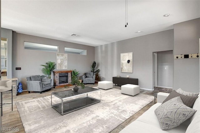 3112 Haddon Dr, Las Vegas, NV 89134 - living area featuring a fireplace and light wood-type flooring