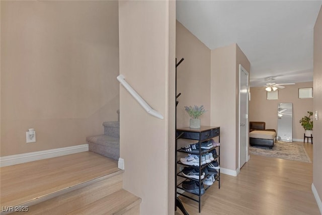 6217 Lapilli Ave, Las Vegas, NV 89139 - stairway featuring wood finished floors, a ceiling fan, and baseboards