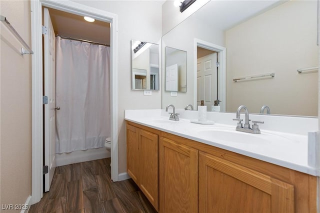 9039 Alex Creek Ave, Las Vegas, NV 89149 - full bathroom featuring wood finished floors, double vanity, toilet, and shower / bath combo with shower curtain