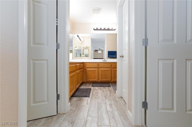 9039 Alex Creek Ave, Las Vegas, NV 89149 - bathroom featuring vanity, wood finished floors, and a ceiling fan