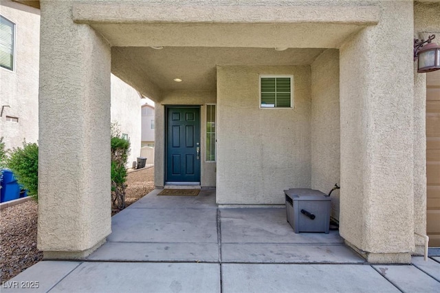 9039 Alex Creek Ave, Las Vegas, NV 89149 - entrance to property featuring stucco siding and a patio
