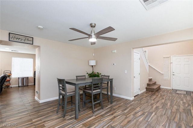 9039 Alex Creek Ave, Las Vegas, NV 89149 - dining area featuring wood finished floors, a ceiling fan, stairway, and baseboards