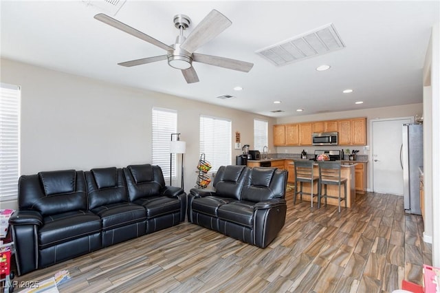 9039 Alex Creek Ave, Las Vegas, NV 89149 - living area with light wood-type flooring, recessed lighting, and ceiling fan