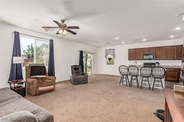 3821 E Summit Ave, Pahrump, NV 89061 - living room with ceiling fan, carpet flooring, and recessed lighting