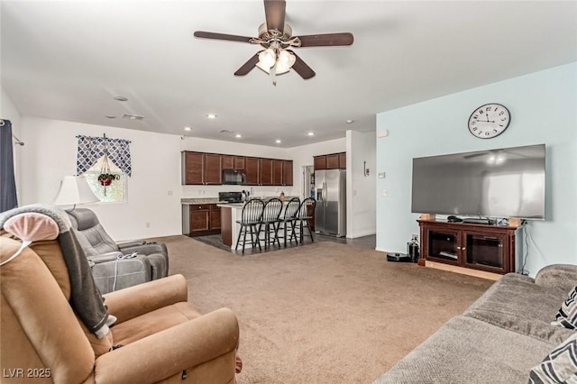 3821 E Summit Ave, Pahrump, NV 89061 - carpeted living area with a ceiling fan and recessed lighting