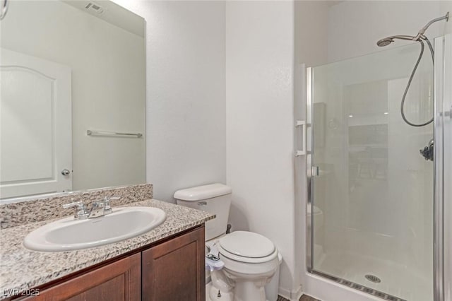 3821 E Summit Ave, Pahrump, NV 89061 - bathroom featuring a shower stall, toilet, and vanity
