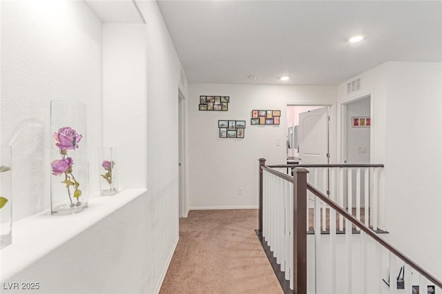 3821 E Summit Ave, Pahrump, NV 89061 - corridor featuring an upstairs landing, light colored carpet, recessed lighting, and baseboards