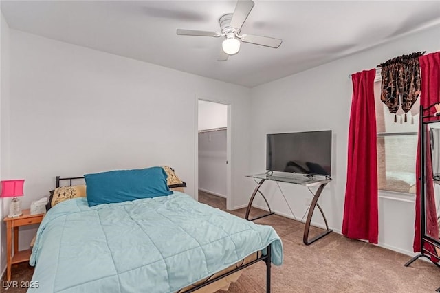 3821 E Summit Ave, Pahrump, NV 89061 - bedroom with carpet flooring, ceiling fan, a walk in closet, and baseboards