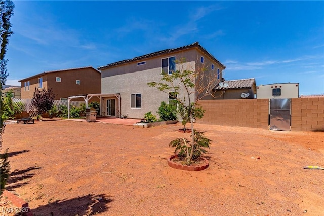 3821 E Summit Ave, Pahrump, NV 89061 - rear view of house with a pergola, a fenced backyard, stucco siding, and a patio