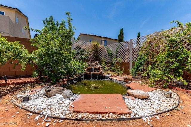 3821 E Summit Ave, Pahrump, NV 89061 - fenced backyard with a small pond