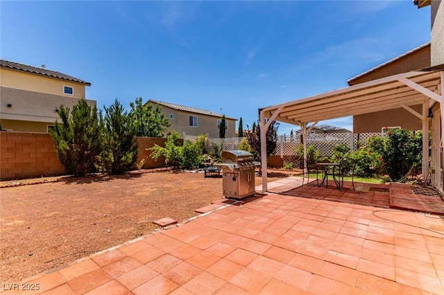 3821 E Summit Ave, Pahrump, NV 89061 - fenced backyard featuring area for grilling, a patio area, and a pergola