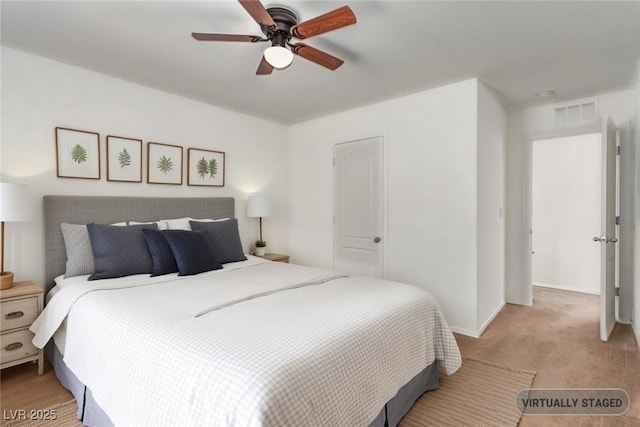 3821 E Summit Ave, Pahrump, NV 89061 - bedroom featuring light carpet, baseboards, and ceiling fan