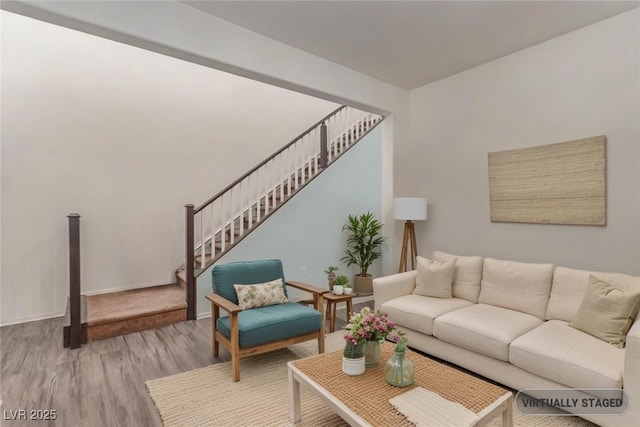 3821 E Summit Ave, Pahrump, NV 89061 - living room featuring wood finished floors, stairway, and baseboards