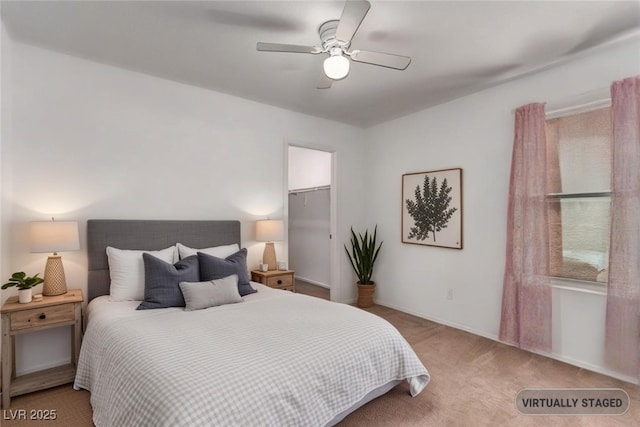 3821 E Summit Ave, Pahrump, NV 89061 - bedroom with carpet, a spacious closet, a ceiling fan, and baseboards