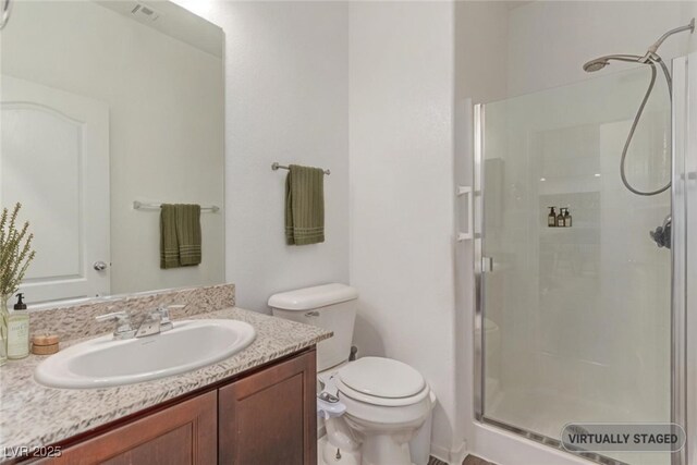 3821 E Summit Ave, Pahrump, NV 89061 - full bathroom with a shower stall, vanity, and toilet