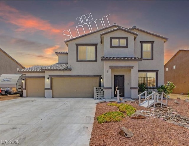 3821 E Summit Ave, Pahrump, NV 89061 - mediterranean / spanish-style house featuring a tiled roof, stucco siding, driveway, and an attached garage