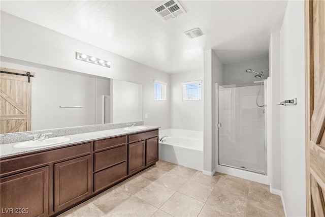4519 Stardusk Falls Ave, North Las Vegas, NV 89084 - full bath featuring a garden tub, a stall shower, double vanity, and tile patterned floors