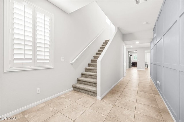 4519 Stardusk Falls Ave, North Las Vegas, NV 89084 - hallway with light tile patterned flooring, stairway, baseboards, and recessed lighting