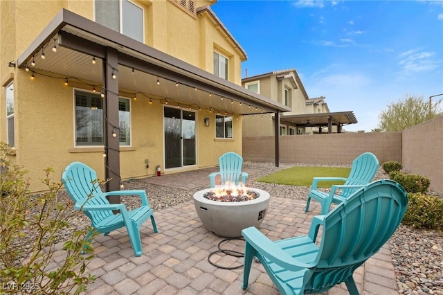 4519 Stardusk Falls Ave, North Las Vegas, NV 89084 - fenced backyard with an outdoor fire pit and a patio area