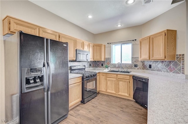 983 Cutter St, Henderson, NV 89011 - kitchen with black appliances, light brown cabinets, light countertops, and recessed lighting