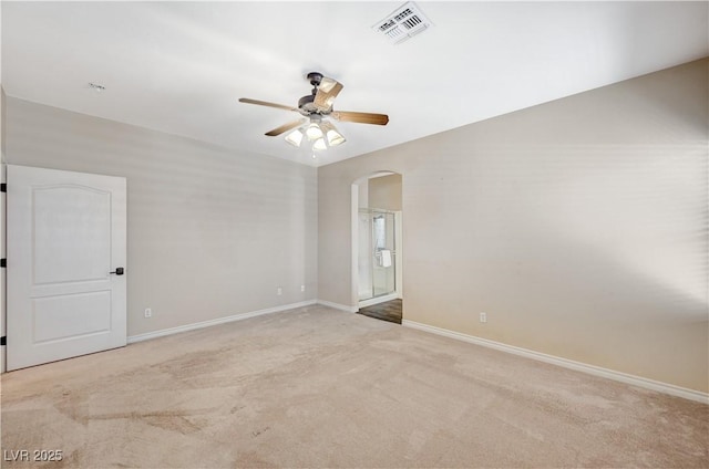 983 Cutter St, Henderson, NV 89011 - spare room featuring arched walkways, a ceiling fan, and light carpet