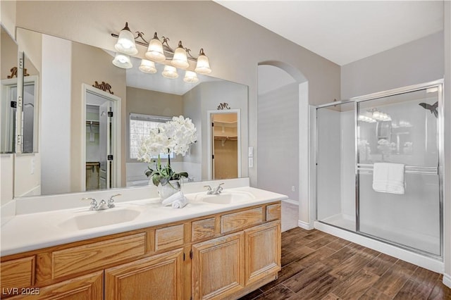 983 Cutter St, Henderson, NV 89011 - full bath featuring a stall shower, wood finished floors, a walk in closet, and double vanity