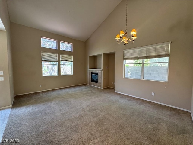 5861 Varese Dr, Las Vegas, NV 89141 - unfurnished living room with high vaulted ceiling, a chandelier, healthy amount of natural light, baseboards, and carpet floors
