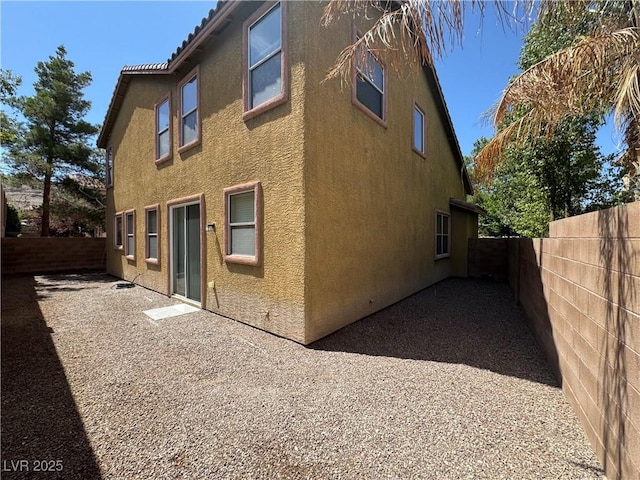 5861 Varese Dr, Las Vegas, NV 89141 - view of side of property with stucco siding and a fenced backyard