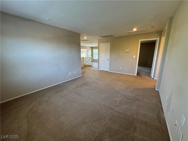 5861 Varese Dr, Las Vegas, NV 89141 - carpeted spare room featuring baseboards and attic access