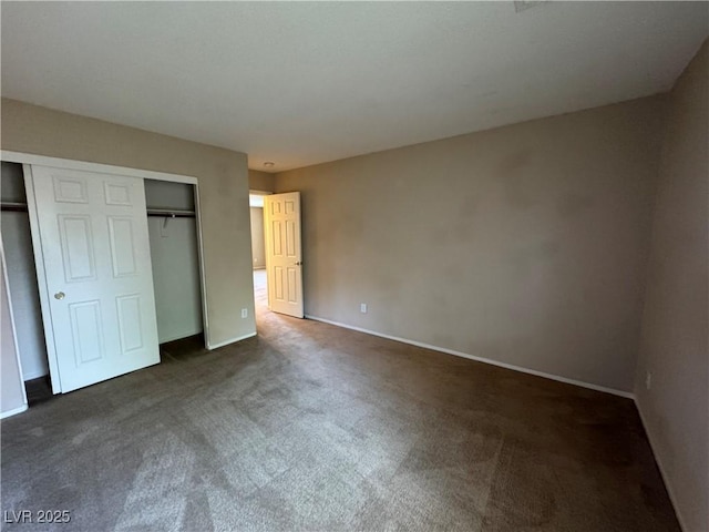 5861 Varese Dr, Las Vegas, NV 89141 - unfurnished bedroom with dark carpet, a closet, and baseboards
