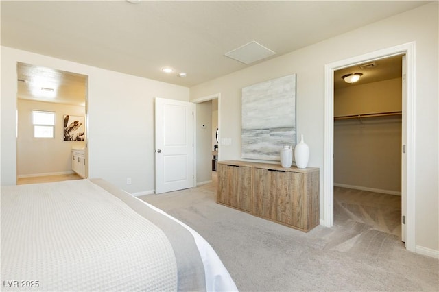 6730 Pivot Point St, Las Vegas, NV 89148 - bedroom with a walk in closet, light colored carpet, ensuite bathroom, and a closet