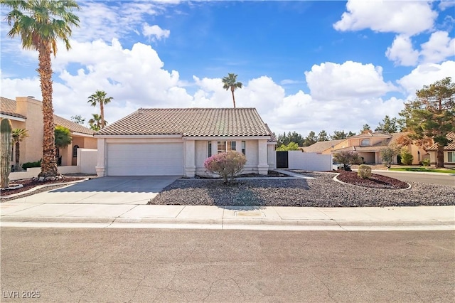 765 Butternut Ct, Henderson, NV 89014 - view of front of property featuring a tile roof, driveway, a garage, and stucco siding