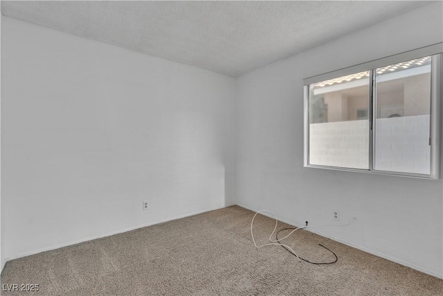 765 Butternut Ct, Henderson, NV 89014 - carpeted spare room featuring baseboards and a textured ceiling