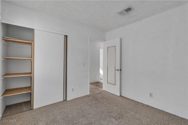 765 Butternut Ct, Henderson, NV 89014 - unfurnished bedroom featuring carpet, a textured ceiling, and a closet