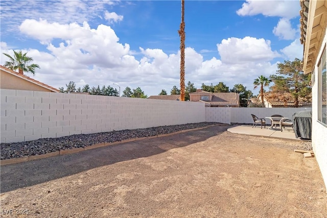 765 Butternut Ct, Henderson, NV 89014 - fenced backyard featuring a patio area
