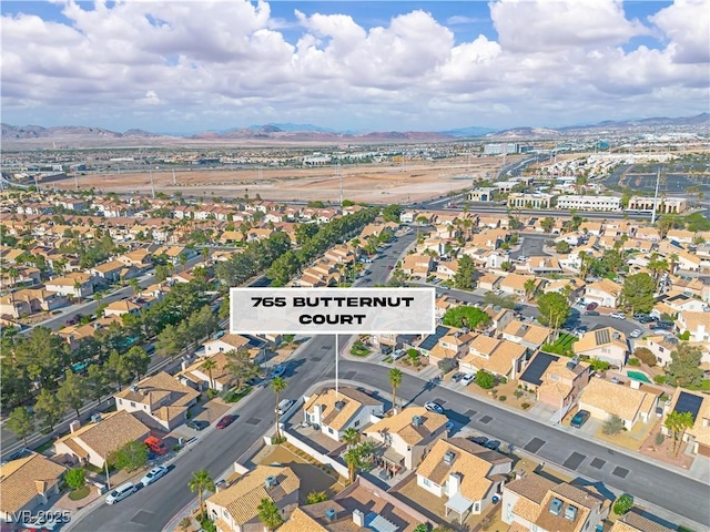 765 Butternut Ct, Henderson, NV 89014 - aerial view of property and surrounding area featuring a mountain backdrop and nearby suburban area