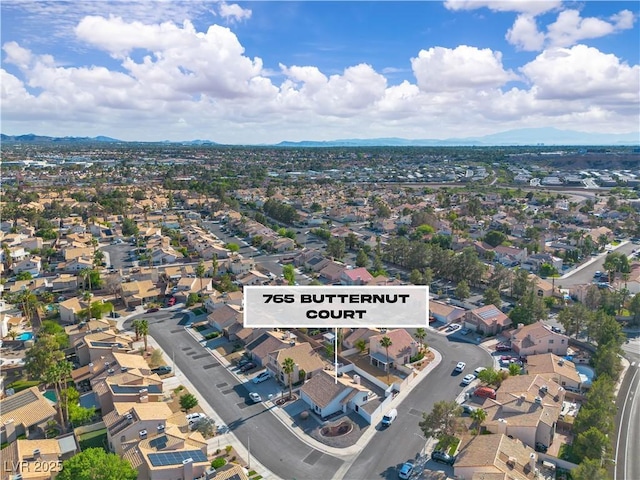 765 Butternut Ct, Henderson, NV 89014 - aerial overview of property's location with nearby suburban area and a mountainous background