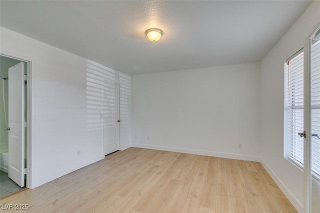 6800 E Lake Mead Blvd Unit 1034, Las Vegas, NV 89156 - unfurnished room with light wood-type flooring and baseboards