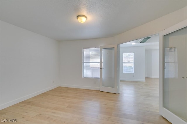 6800 E Lake Mead Blvd Unit 1034, Las Vegas, NV 89156 - unfurnished room with light wood-style flooring and baseboards