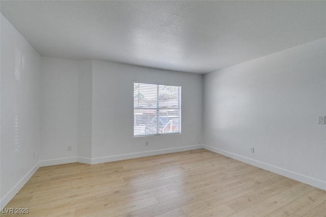 6800 E Lake Mead Blvd Unit 1034, Las Vegas, NV 89156 - spare room with light wood-style flooring and baseboards
