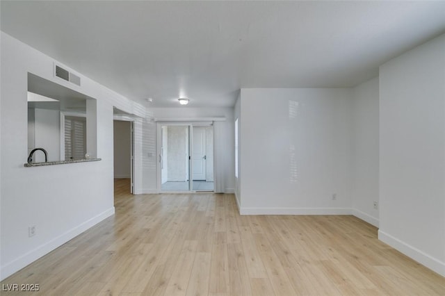 6800 E Lake Mead Blvd Unit 1034, Las Vegas, NV 89156 - unfurnished room featuring baseboards and wood finished floors