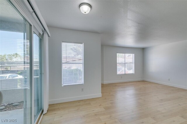 6800 E Lake Mead Blvd Unit 1034, Las Vegas, NV 89156 - spare room featuring light wood finished floors and baseboards