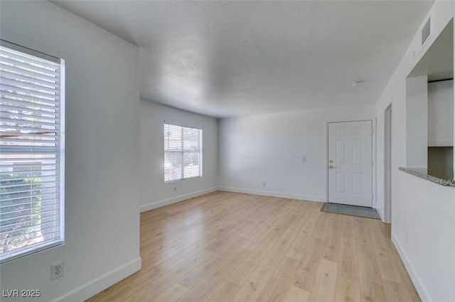 6800 E Lake Mead Blvd Unit 1034, Las Vegas, NV 89156 - empty room with light wood-type flooring and baseboards